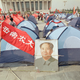 Students decorate tents in a Tiananmen Square camp with a banner and Mao portrait.